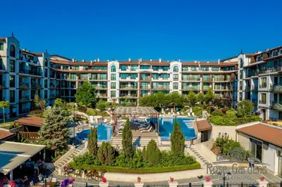 an apartment complex with a swimming pool and a resort at Rose Gardens Apart Hotel in Pomorie
