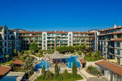 an apartment complex with a pool and a resort at Rose Gardens Apart Hotel in Pomorie