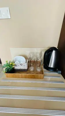 a wooden tray with glasses on top of a drawer at PARADISO 'В' 609 Studio Nessebar Private in Nesebar
