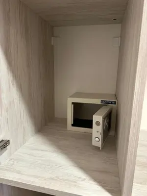 a small room with a tv in a wall at Oleander House and Tennis Club in Sunny Beach