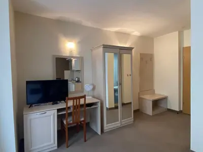 a room with a desk with a computer and a television at AVALON D202 Private Studio Sunny Beach in Sunny Beach