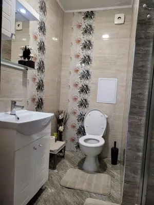 a bathroom with a toilet and a sink at VIP Аpartament in Sunny Beach