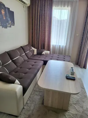 a living room with a couch and a coffee table at VIP Аpartament in Sunny Beach