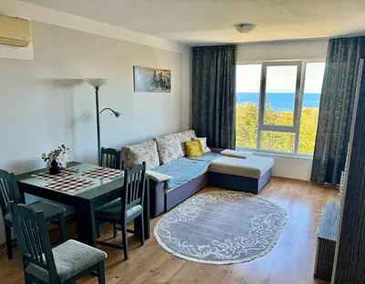 a living room with a couch and a table at SOLITA Apartment with Panoramic View in Byala