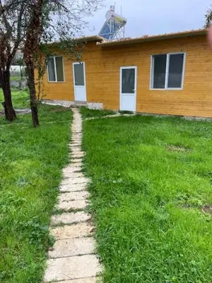 a brick path leading to a house in the grass at Sun Houses Novo Oriahovo in Novo Oryakhovo