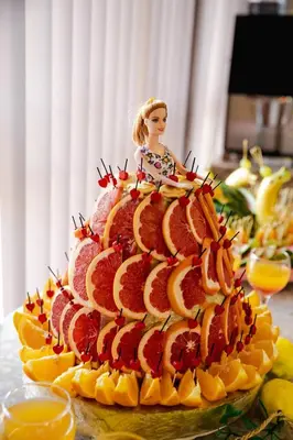 a cake with a doll sitting on top of it at K&E studios and apartments - All inclusive - Free parking in Sunny Beach
