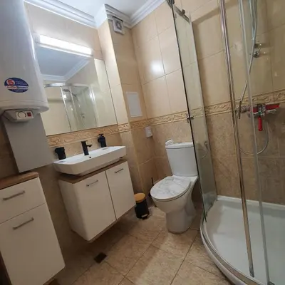 a bathroom with a shower and a toilet and a sink at Apartment Marina Dinevi View in Sveti Vlas