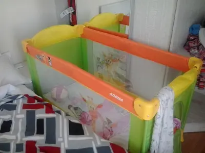 a childs toy crib in a bedroom at Mellia Boutique Apartments in Ravda