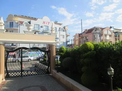a gate in front of a building with houses at Mellia Boutique Apartments in Ravda
