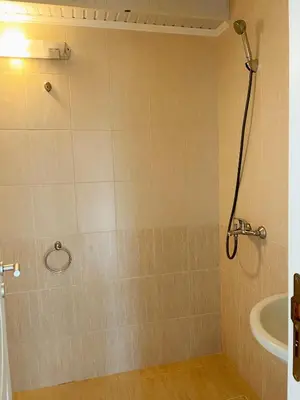 a bathroom with a shower and a sink at Mellia Boutique Apartments in Ravda