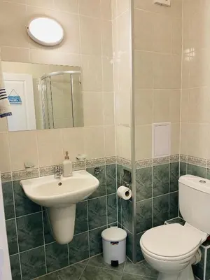 a bathroom with a toilet and a sink at Апартамент Бриз 16 in Sunny Beach