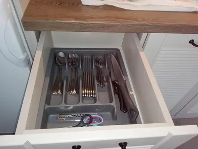 a drawer in a kitchen with utensils in it at апартамент Релакс in Varna City