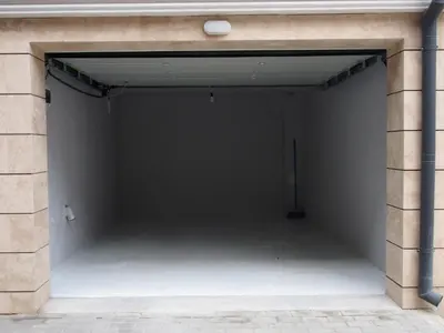 an empty garage with a brick wall at апартамент Релакс in Varna City