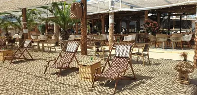 a group of chairs and tables in a restaurant at Golden Sunrise in Shkorpilovtsi