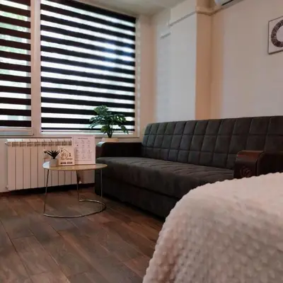 a living room with a couch and a table at Ika studio in Burgas City