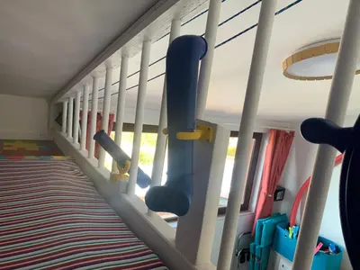 a childrens play room with a row of chairs at Seaview Holiday - Черноморска почивка in Aheloy
