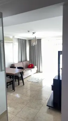 a living room with a couch and a table at Lazur Sea View, Sveti Vlas Beach in Sveti Vlas