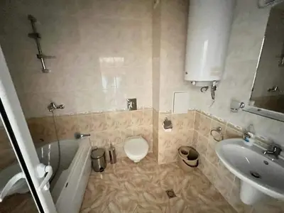 a bathroom with a toilet and a tub and a sink at Magic Dreams St Vlas in Sunny Beach