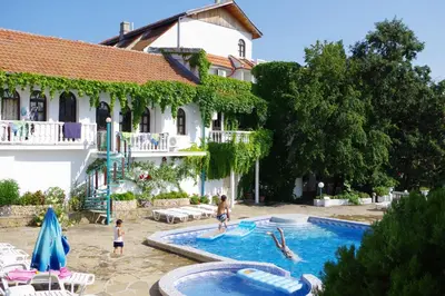 a group of people playing in a swimming pool at Hotel Gamartata in Duni