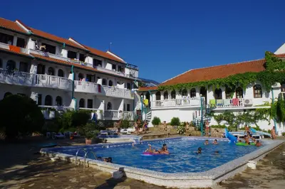 a group of people in a swimming pool in a hotel at Hotel Gamartata in Duni