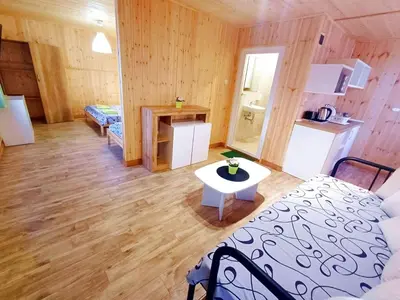 a room with a bed and a table in a room at Elmona Villas in Kamchia