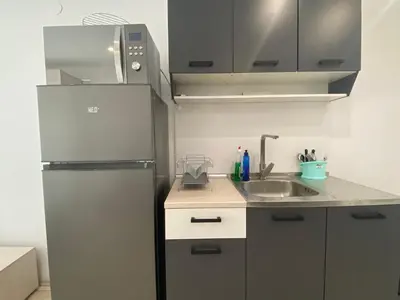 a kitchen with a refrigerator and a sink at PARADISO 'В' 111 Large Apartment Nessebar in Nesebar