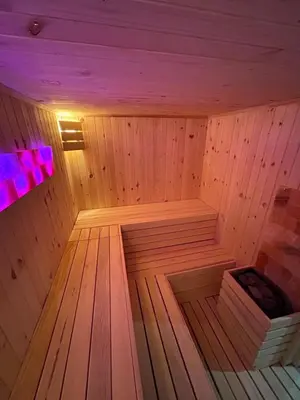 a wooden sauna with a purple light in it at Комплекс Тополица -The beautiful view in Aytos