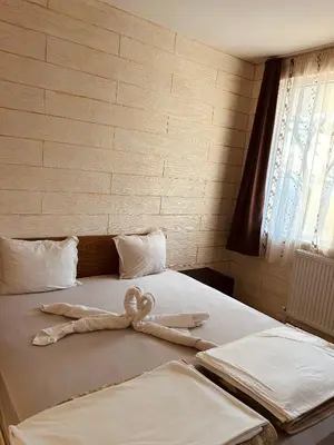 a bed with a stuffed animal on top of it at Комплекс Тополица -The beautiful view in Aytos