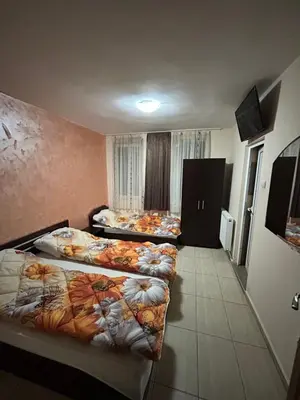 a hotel room with two beds in it at Комплекс Тополица -The beautiful view in Aytos