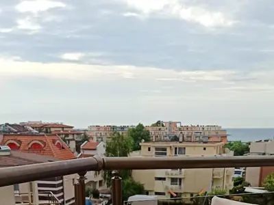 a view of a city from a balcony at Голям апартамент с прекрасна гледка кьм морето in Ravda