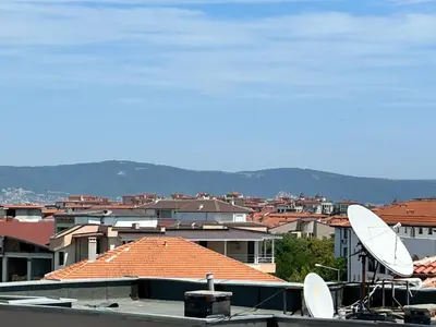 a view of a city with a satellite at Голям апартамент с прекрасна гледка кьм морето in Ravda