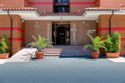 a building with potted plants in front of a building at Apartment complex Mirage of Nessebar in Nesebar