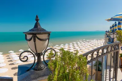 a street light on a balcony next to the beach at Apartment complex Mirage of Nessebar in Nesebar