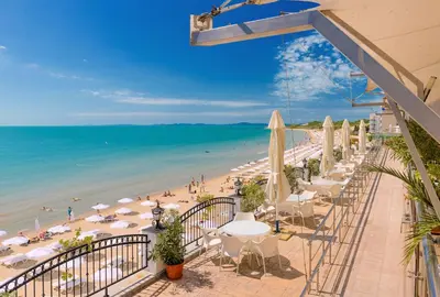 a view of a beach with umbrellas and the ocean at Apartment complex Mirage of Nessebar in Nesebar