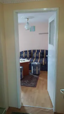 a living room with a couch and a table at Guest House Margarita in Pomorie