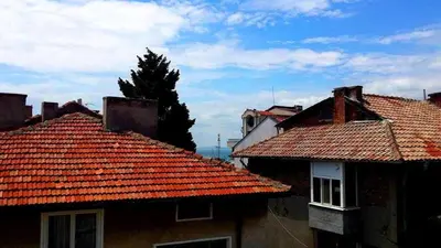 two roofs of two buildings with red tile roofs at Guest House Margarita in Pomorie