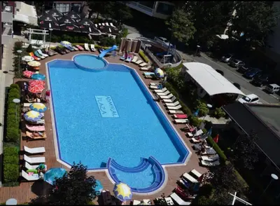 an overhead view of a swimming pool with chairs and umbrellas at Admiral Plaza in Sunny Beach