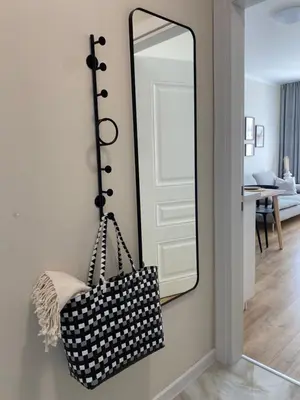 a mirror hanging on a wall next to a door at Ravda Bliss with a pool in Ravda
