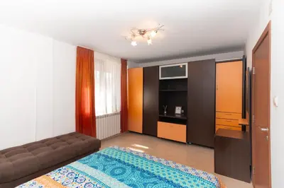 a living room with a bed and a couch at Royal Blue Apartments with Sea View in Old Nessebar in Nesebar