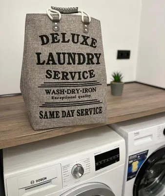 a bag sitting on top of a washing machine at Varna Cathedral Boutique Apartment in Varna City