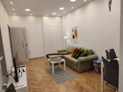 a living room with a couch and a table at Desafinado in Burgas City