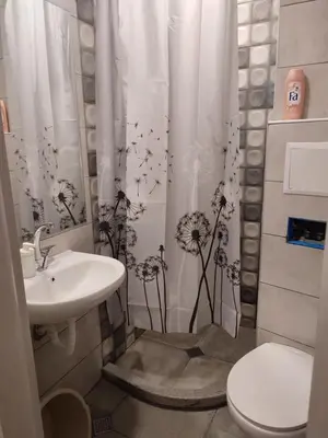 a bathroom with a sink and a toilet and a shower curtain at Desafinado in Burgas City