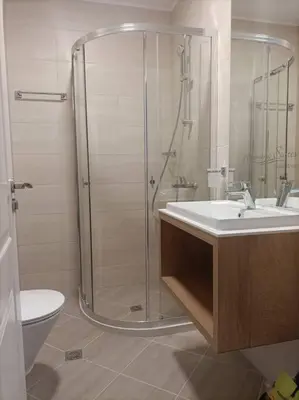 a bathroom with a shower and a sink and a toilet at Apartament Harmony in Sunny Beach