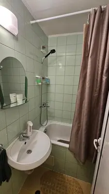 a bathroom with a sink and a shower and a tub at Studio 39 in Sunny Beach