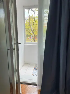 an open door with a window in a room at Holiday Home in Burgas City
