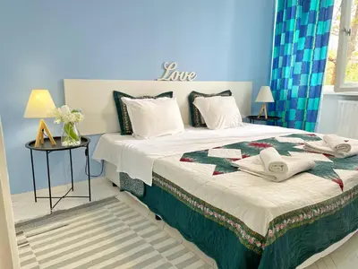 a bedroom with a large bed with towels on it at Holiday Home in Burgas City