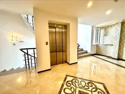 an empty hallway with a door and a rug at Villa Aria - Menada Apartments in Sunny Beach