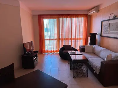a living room with a couch and a table at Oazis VIP Club in Sunny Beach