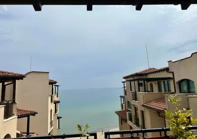 a view of the ocean from between buildings at Oazis VIP Club in Sunny Beach