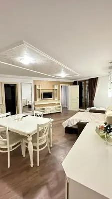 a large living room with a table and a bed at Penthouse Happy Moments 3 in Sunny Beach